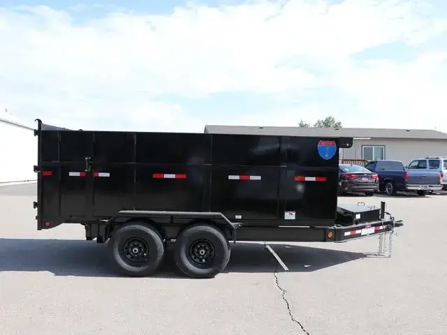 Trash hauling crew loading dump trailer in Kansas City